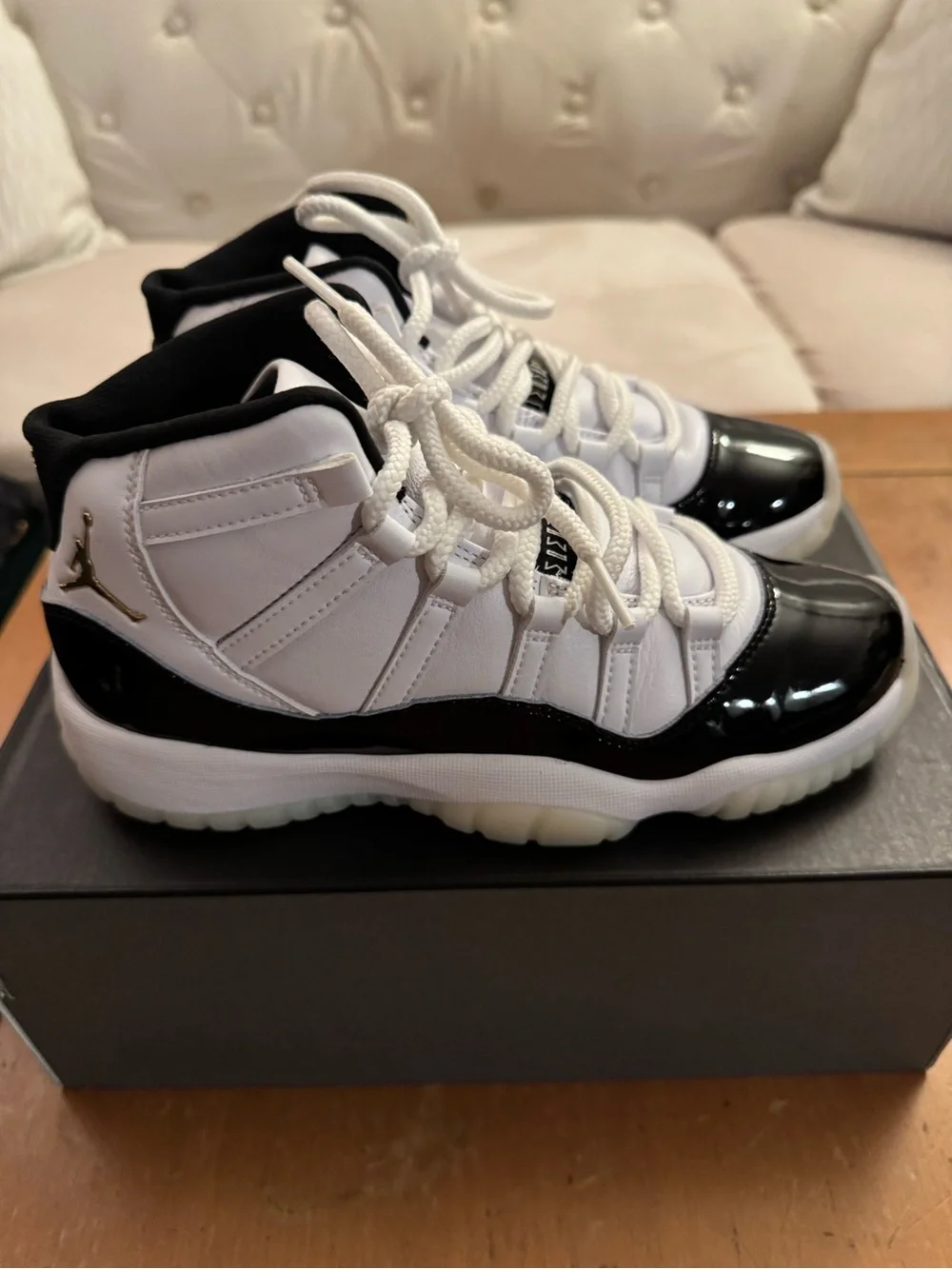Air Jordan 11 Retro (GS) Big Kid’s Sneakers in White and Patent Black